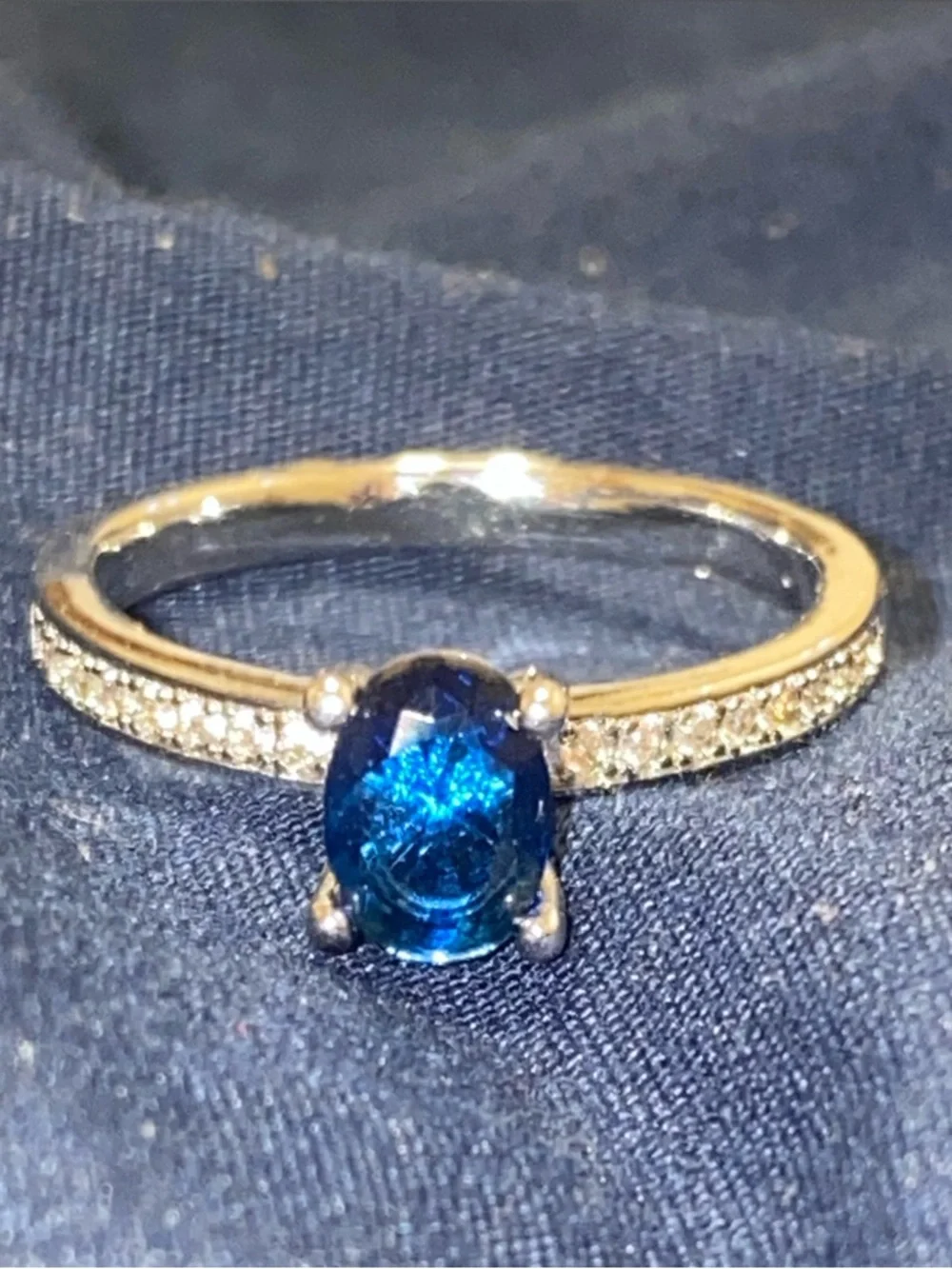 Blue Oval Solitaire Ring with Pavé Band